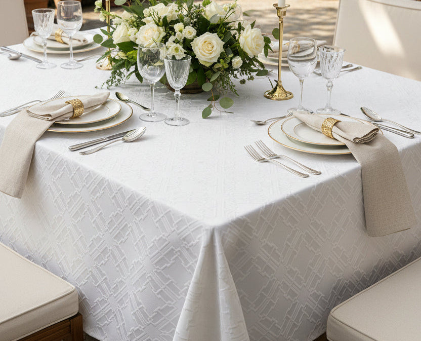 Close view of the raised quilted fret pattern on the Valence white tablecloth