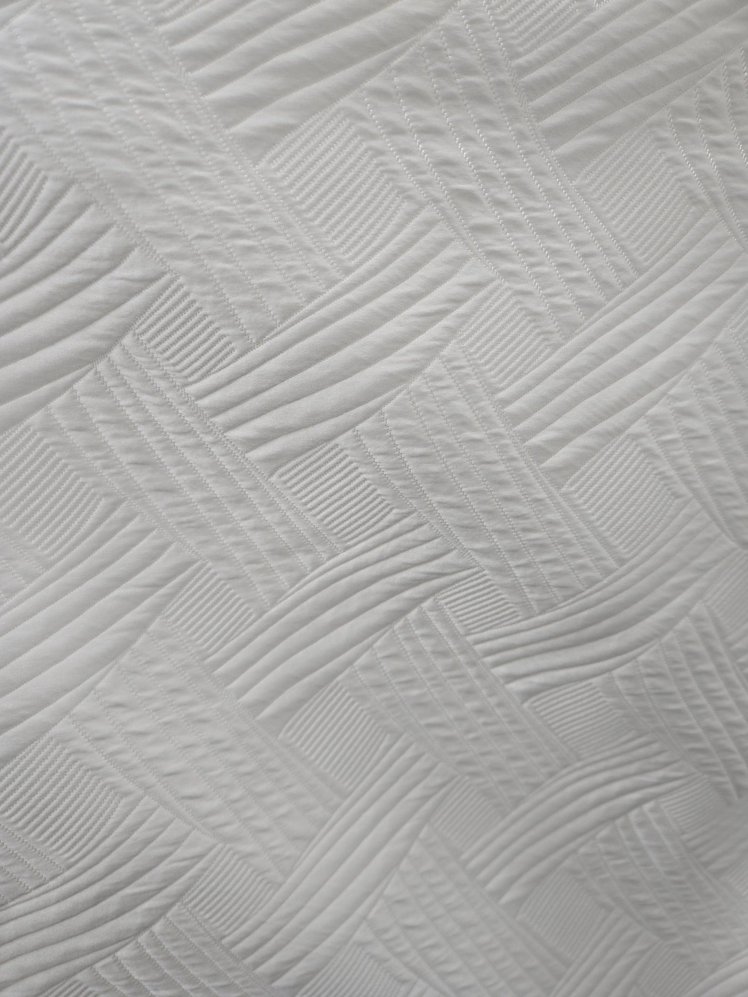 Trellis quilted white tablecloth, full table setting