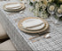 Vincent Boucle Tablecloth in white and black on a set dining table